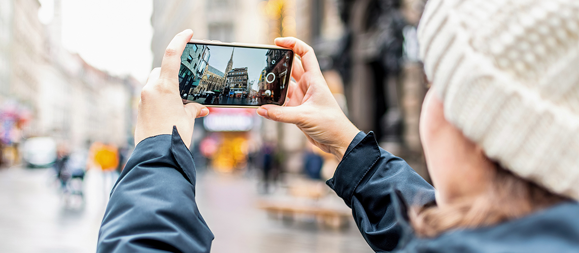 A person making a video with a mobile phone.