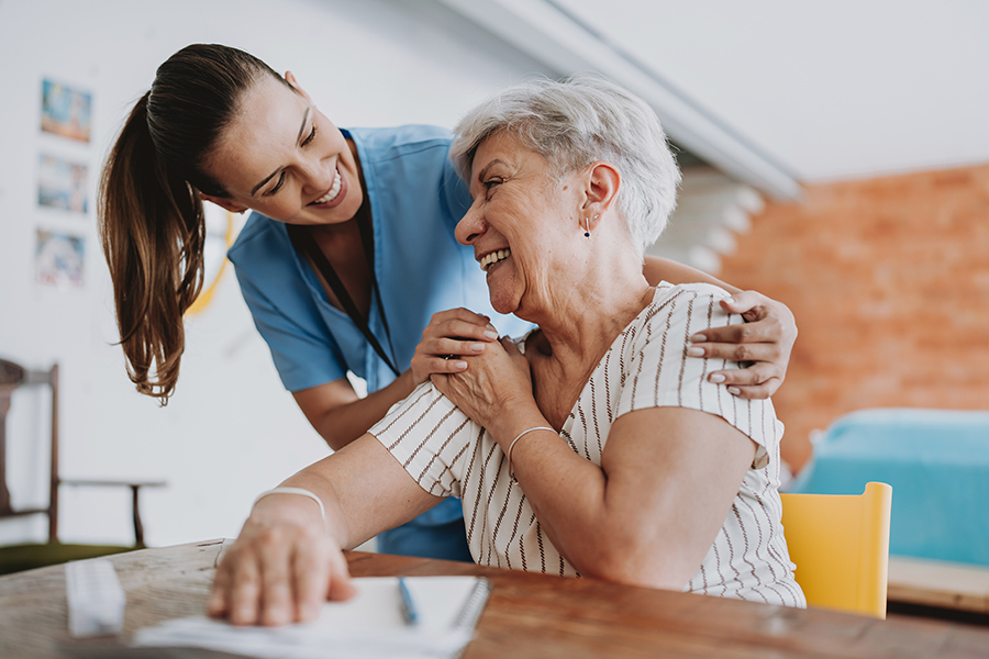 A nurse and an older adult