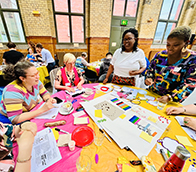 A group of people working around a table